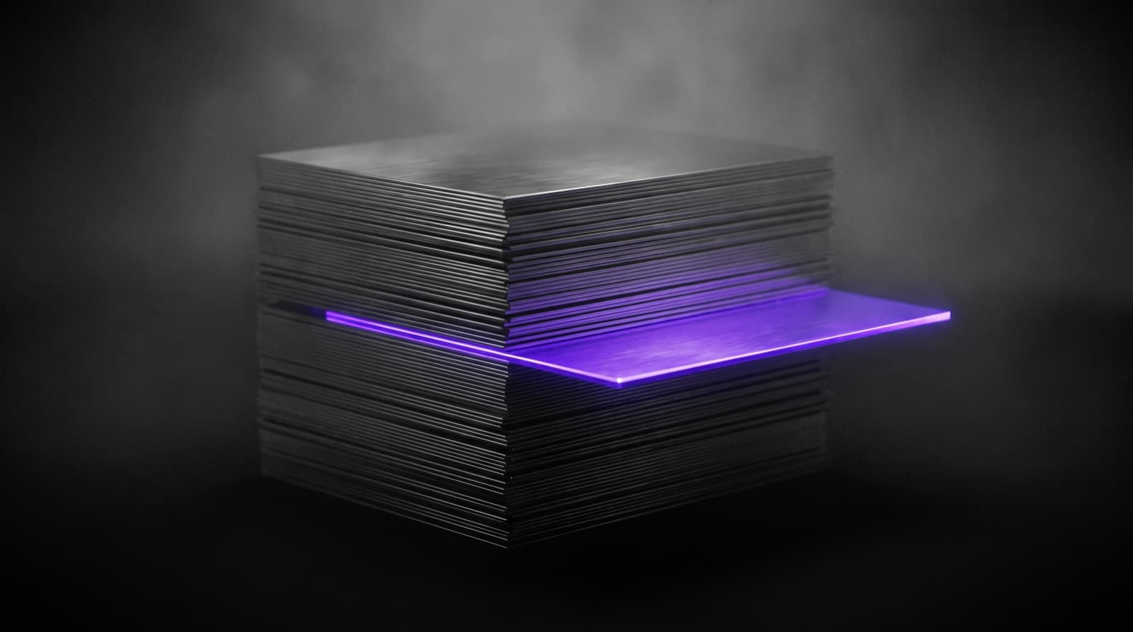 A thick stack of dark brushed-metal plates floating in grey haze. One thin plate is pulled halfway out of the middle of the stack and glows electric violet, the only color in the frame.